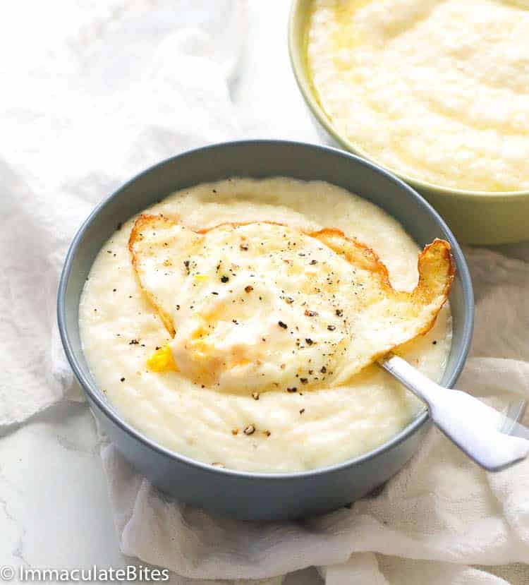 A delicious bowl of savory grits topped with a fried egg