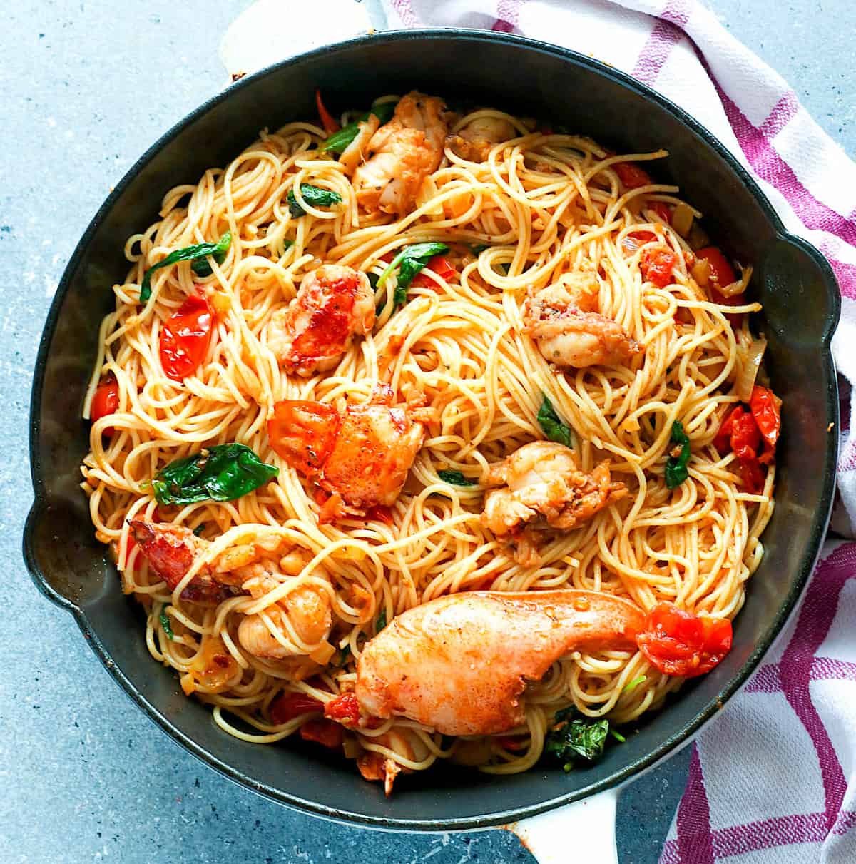 Lobster pasta freshly baked in a frying pan is incredibly delicious