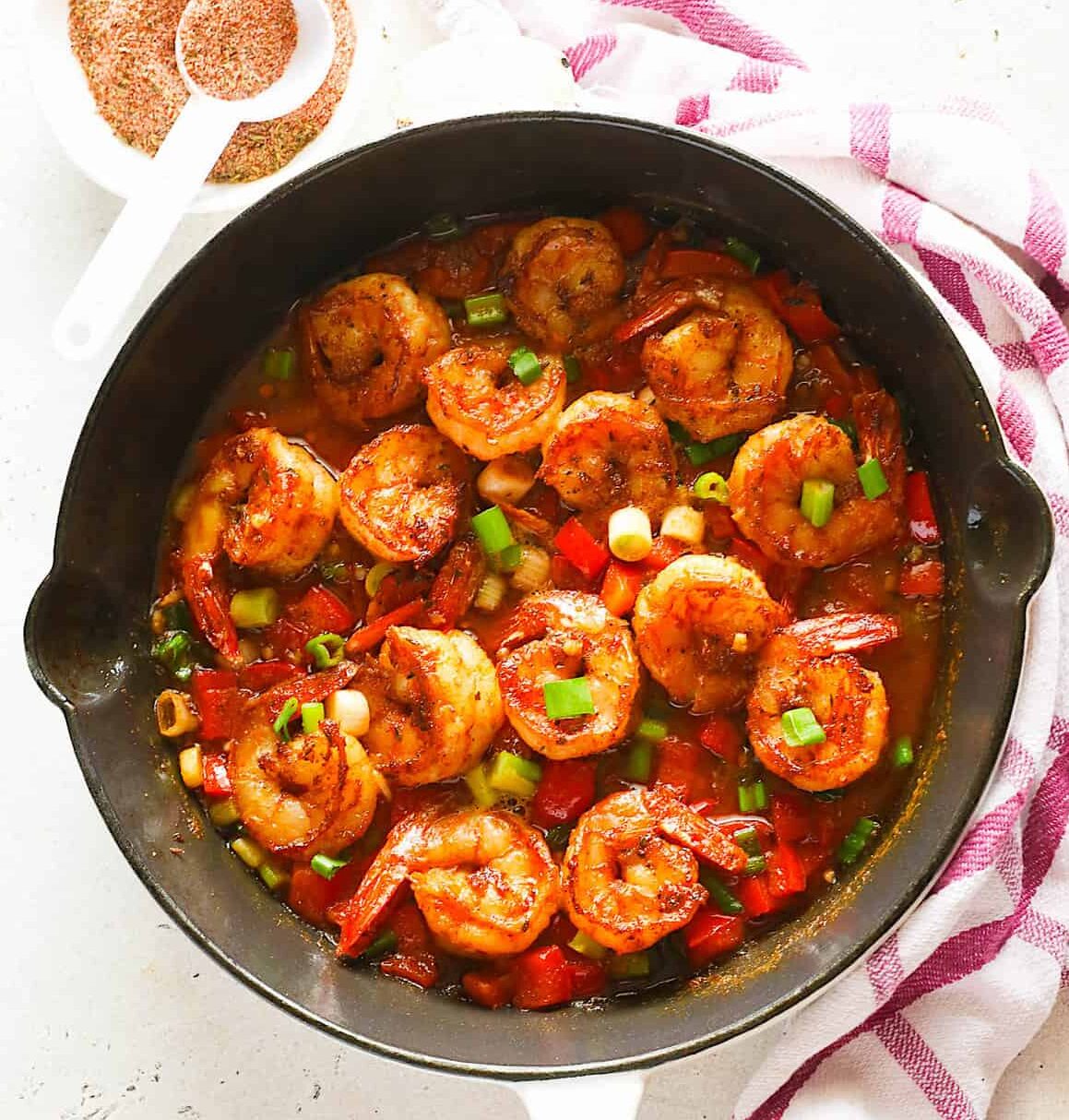 Cajun shrimp hot off the stove and smothered in a ridiculously delicious sauce.