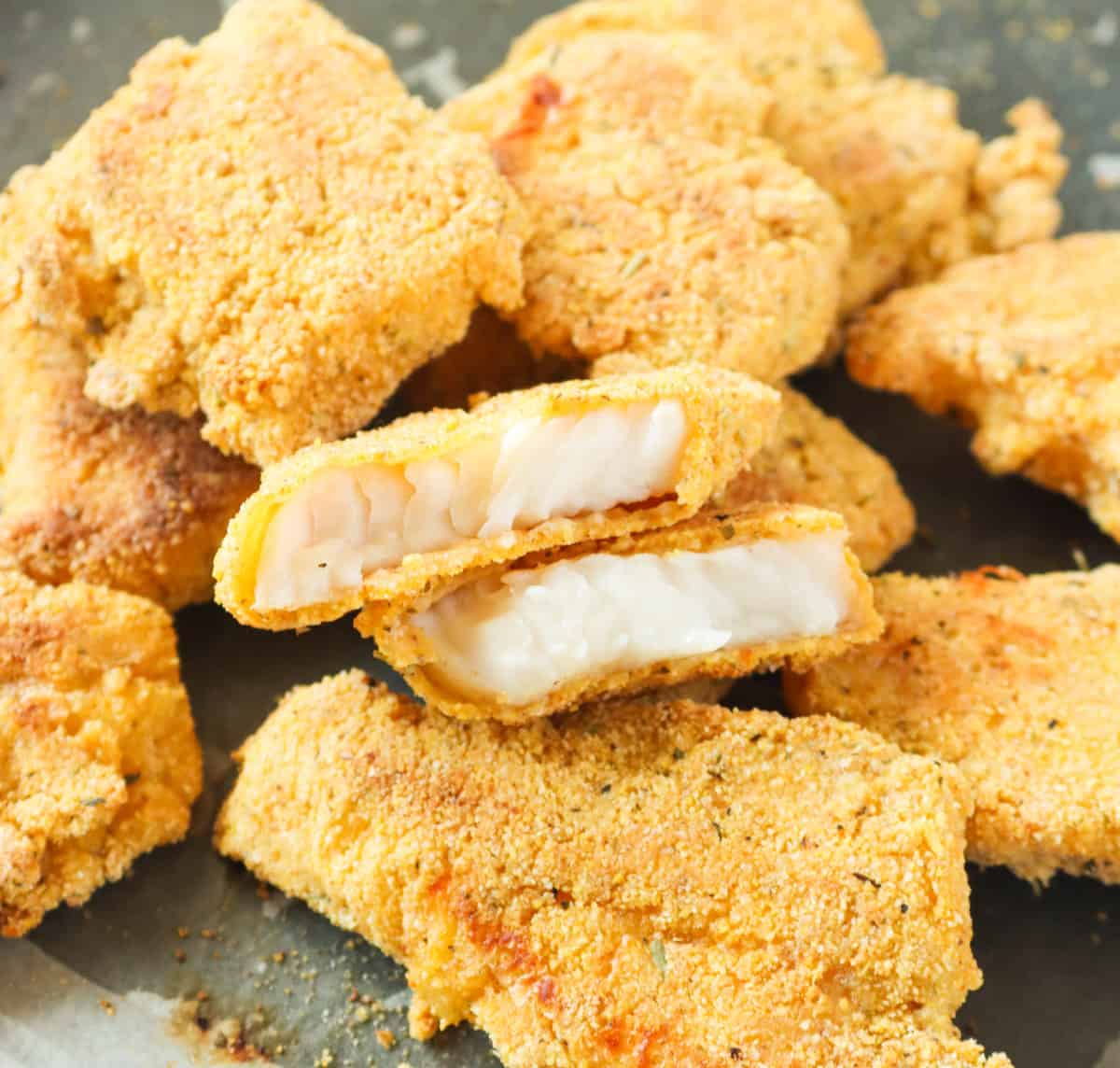 Showing off the tender, flaky insider shot of delicious fried catfish nuggets