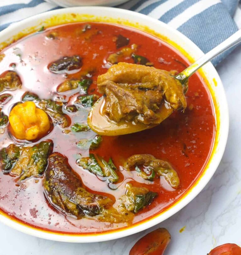 Spooning up a bowl of amazing palm nut soup