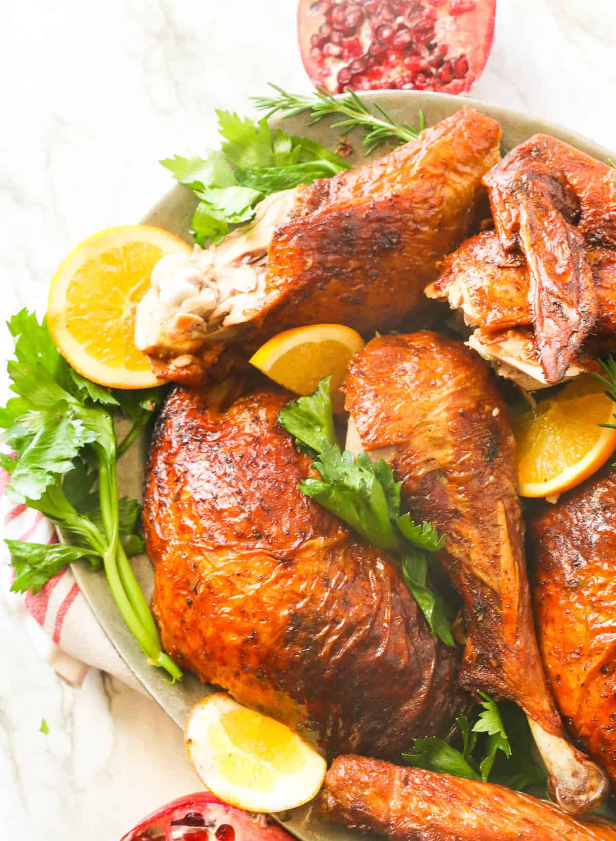 Carved deep fried turkey with lemon and garnishes