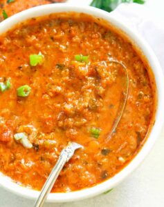Creole sauce with a spoon ready to serve over your fave entree