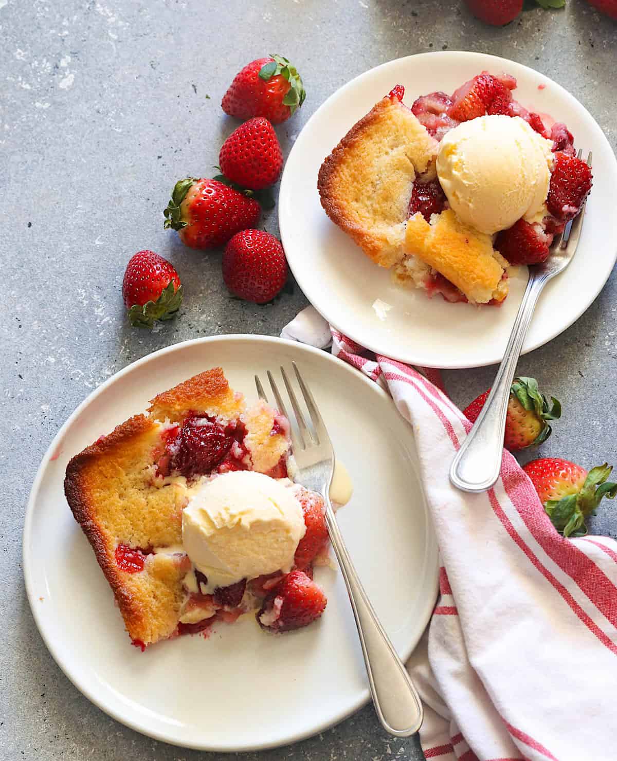 Serving up double the fun with two plates of strawberry cobbler topped with vanilla ice cream