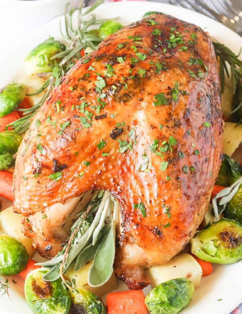 Impress your family with roasted turkey crown with Brussels sprouts and delicious herbs