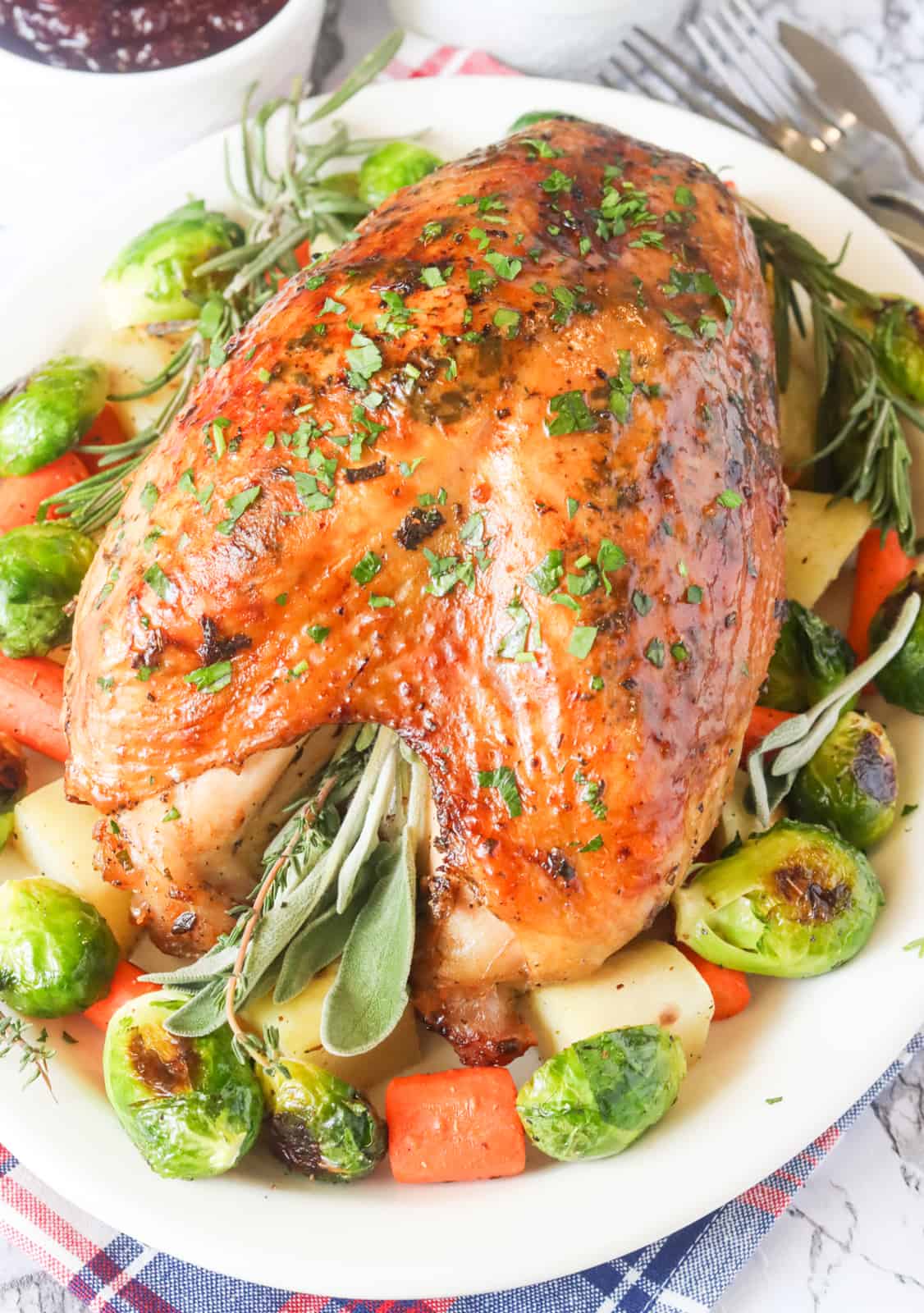 Impress your family with roasted turkey crown with Brussels sprouts and delicious herbs