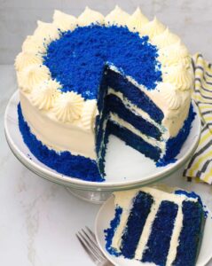 Slicing up an insanely delicious blue velvet cake