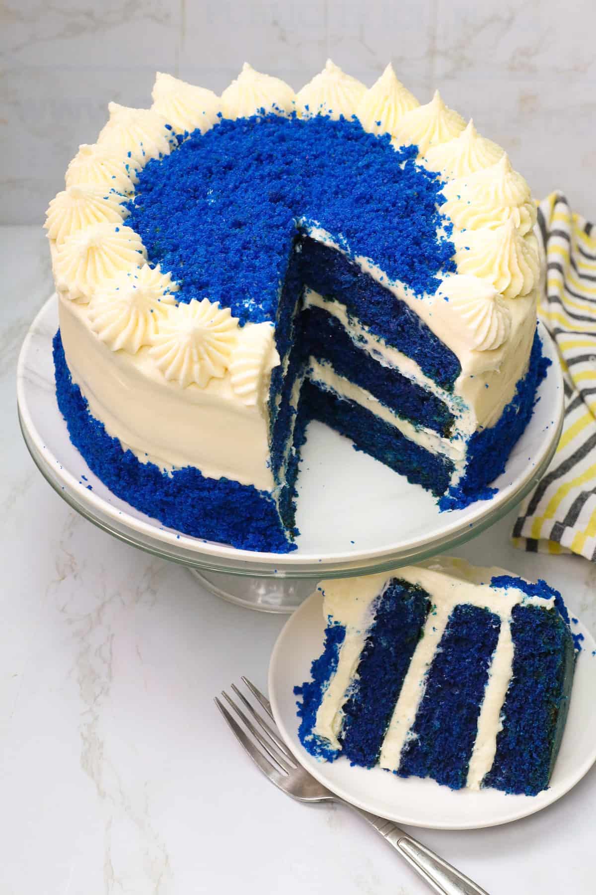 Slicing up an insanely delicious blue velvet cake