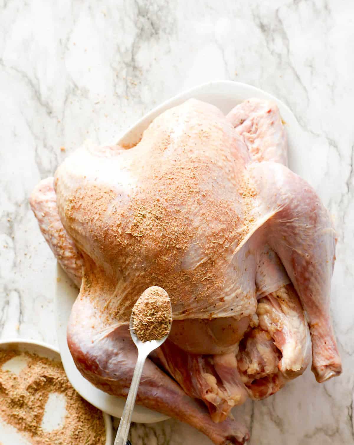Add your favorite rub to your marinade injected turkey and bake or fry