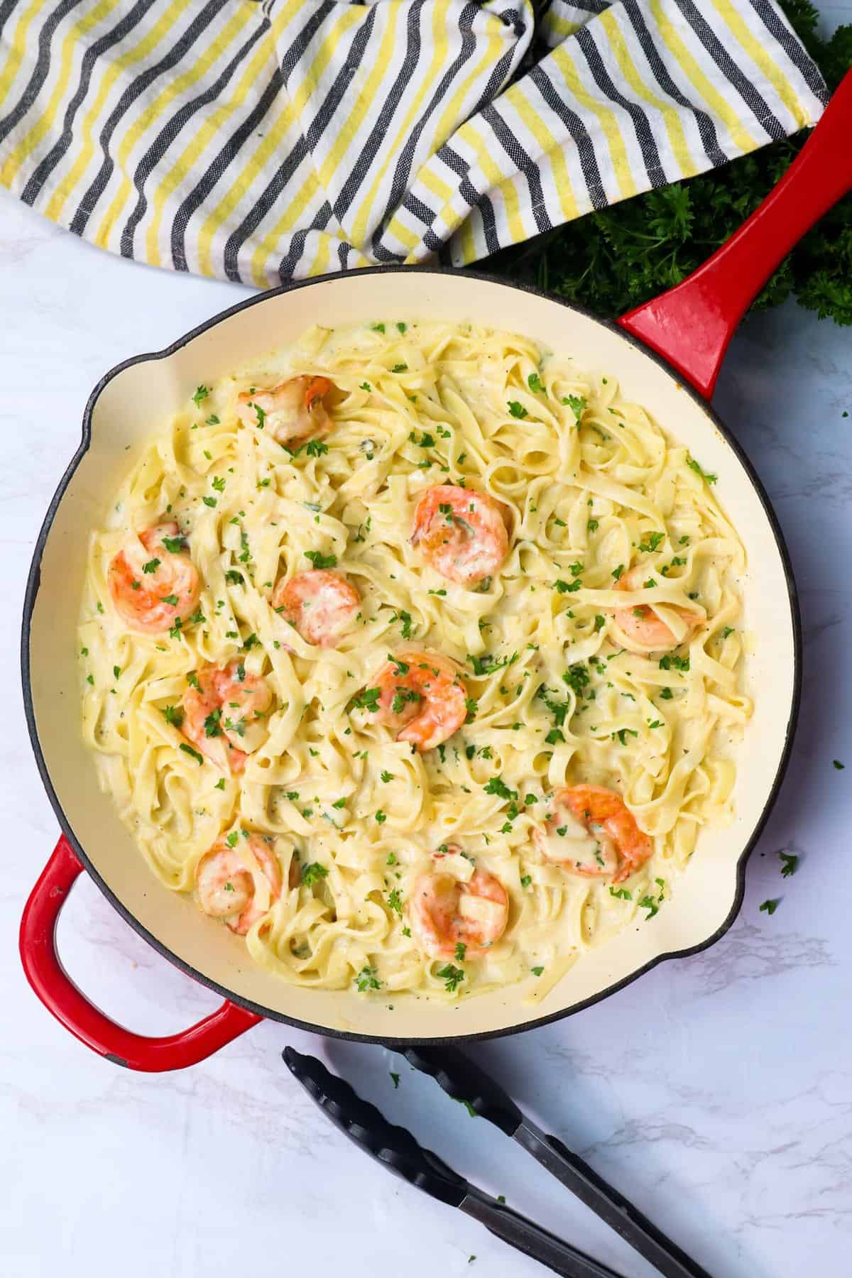 Shrimp Alfredo in a skillet hot off the stove ready to enjoy