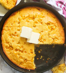 Delectable cornbread with corn with butter melting on top