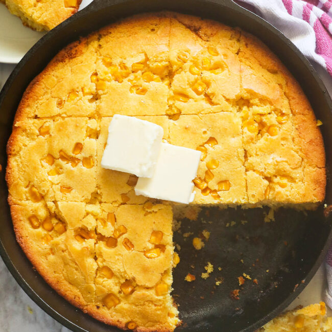 Delectable cornbread with corn with butter melting on top