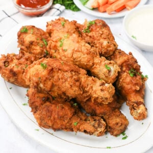 All-time favorite deep fried Chicken Legs with carrot and celery sticks