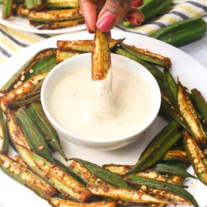 Dipping whole oven roasted okra in mayo sauce