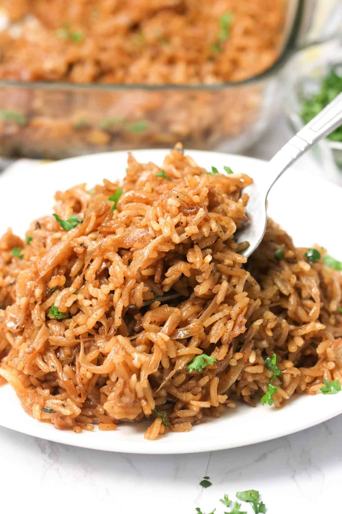 Serving up a plateful of stick of butter rice as a delicious side