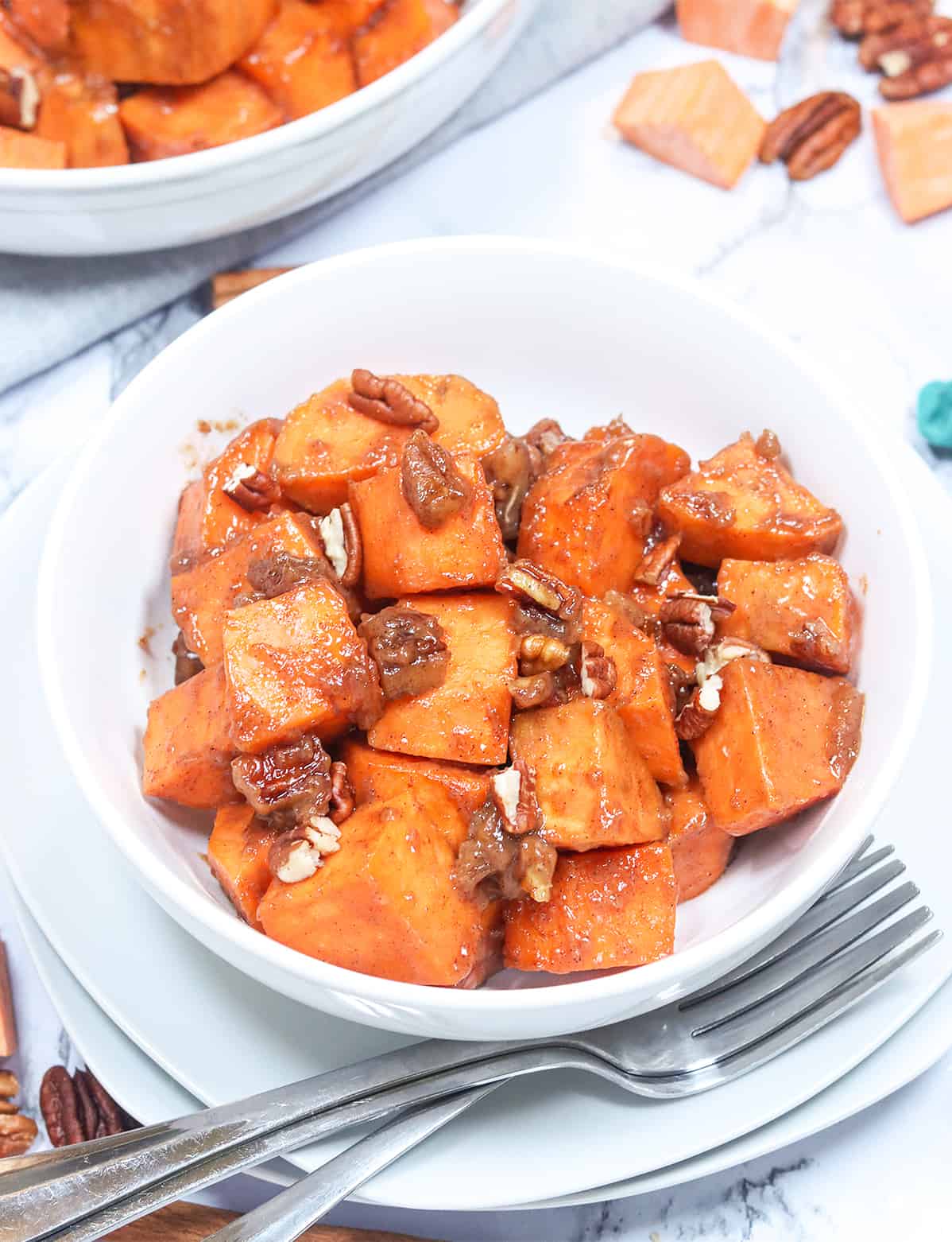 Serving up comforting yam casserole in a white bowl