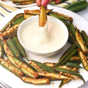 Dipping whole oven roasted okra in mayo sauce