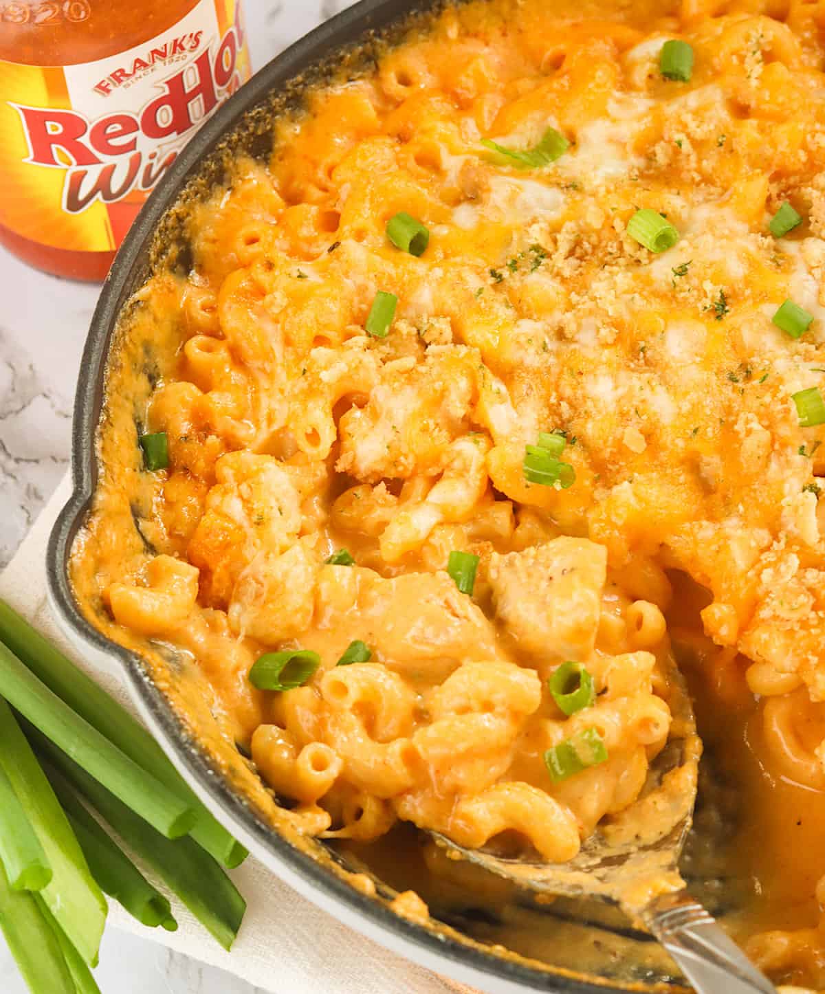 Serving up steaming hot Buffalo Chicken Mac and Cheese with Frank's RedHot on the side
