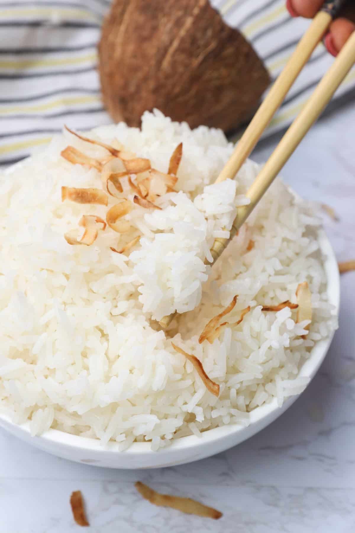 Enjoying Jasmine Coconut Rice with chopsticks