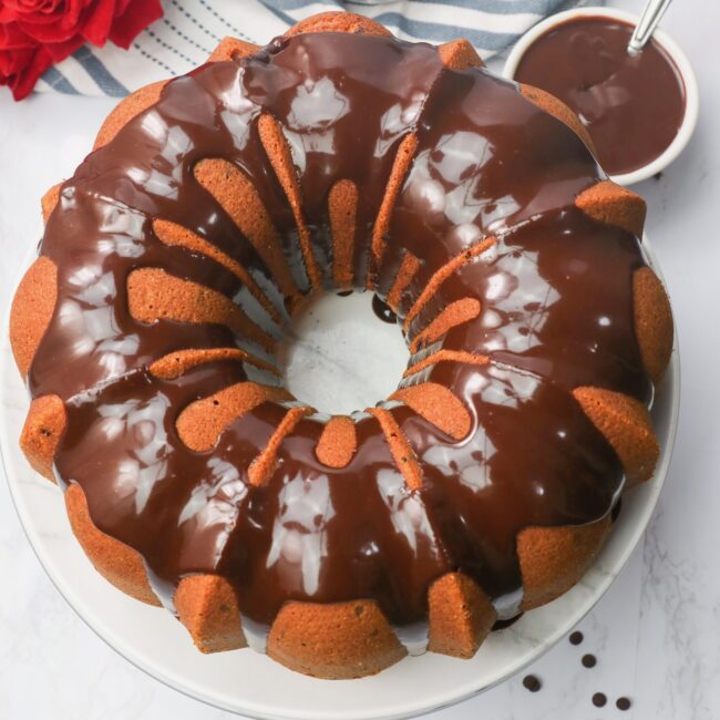 A freshly glazed Chocolate Chip Bundt Cake ready to serve and enjoy