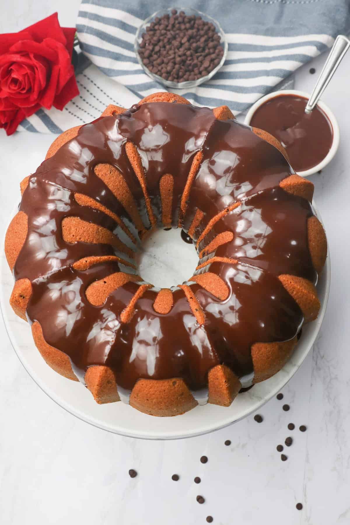 A freshly glazed Chocolate Chip Bundt Cake ready to serve and  enjoy