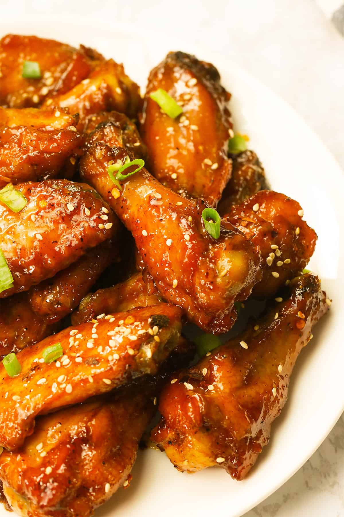 Honey Hot Wings - Baked to crispy perfection on a white platter