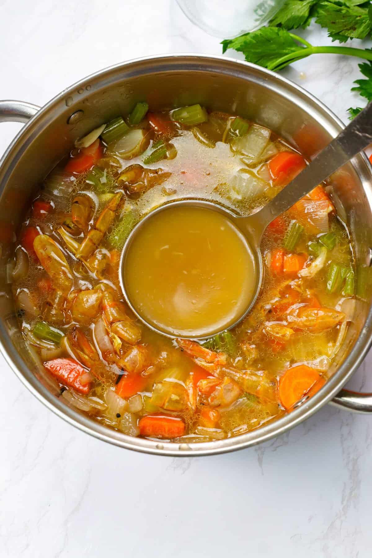 Straining freshly made Shrimp Stock