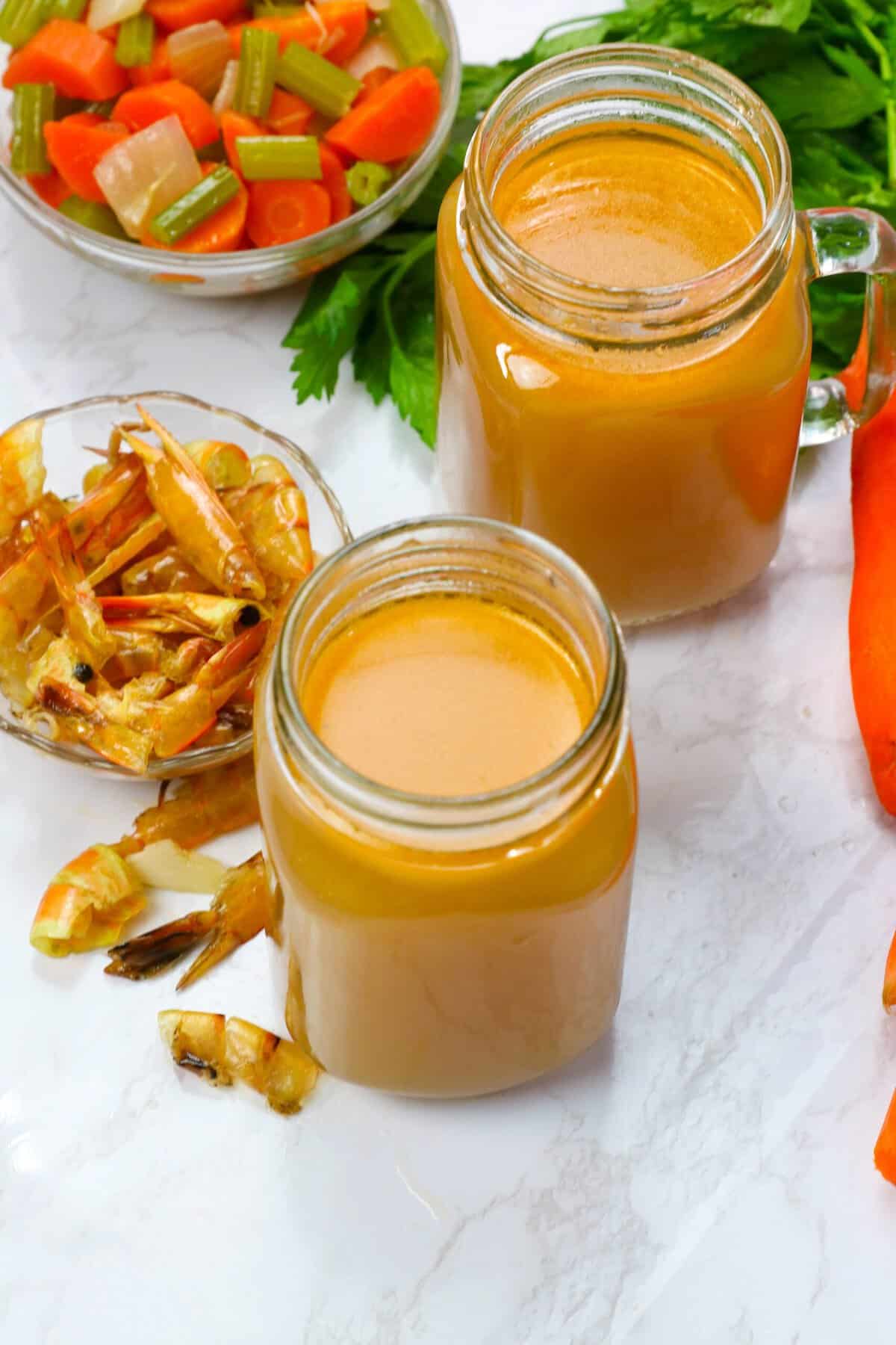 The finished shrimp stock recipe stored in a jar.