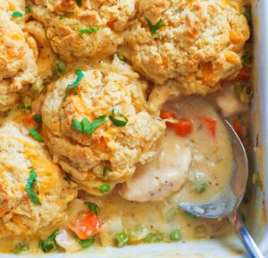 Creamy Chicken and Biscuits with peas and carrots and decadent creamy gravy