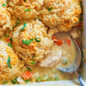 Creamy Chicken and Biscuits with peas and carrots and decadent creamy gravy