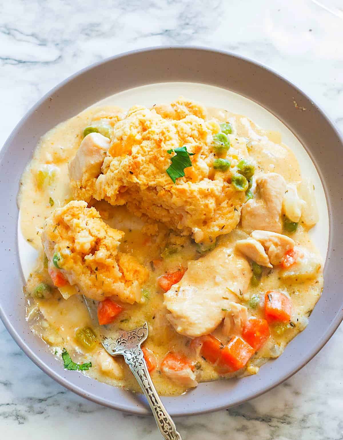 Enjoying a bowl of Creamy Chicken and Biscuits