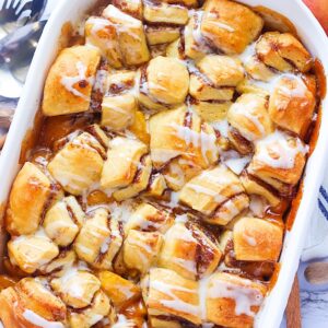 Glazed Cinnamon Roll Peach Cobbler for the ultimate comfort food dessert