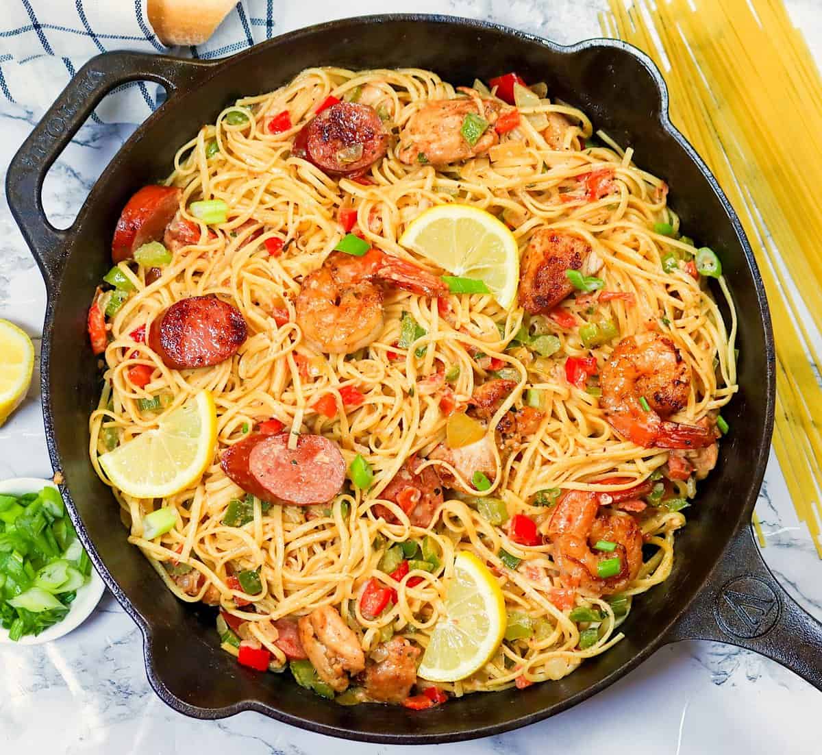 A fresh skillet full of soul-satisfying Pastalaya with sausage, chicken, and shrimp