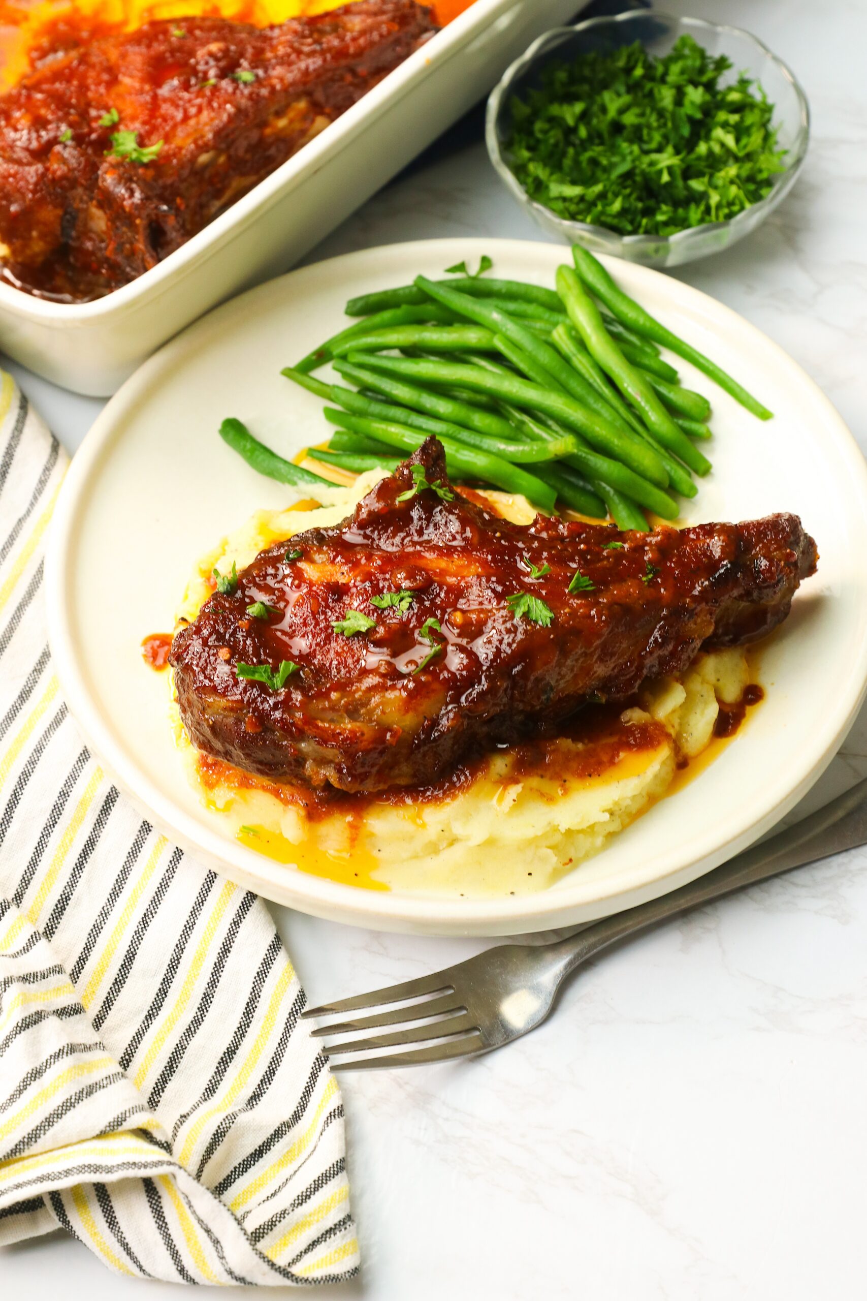 Comfort food Oven BBQ Pork Chops with mashed potatoes and roasted green beans
