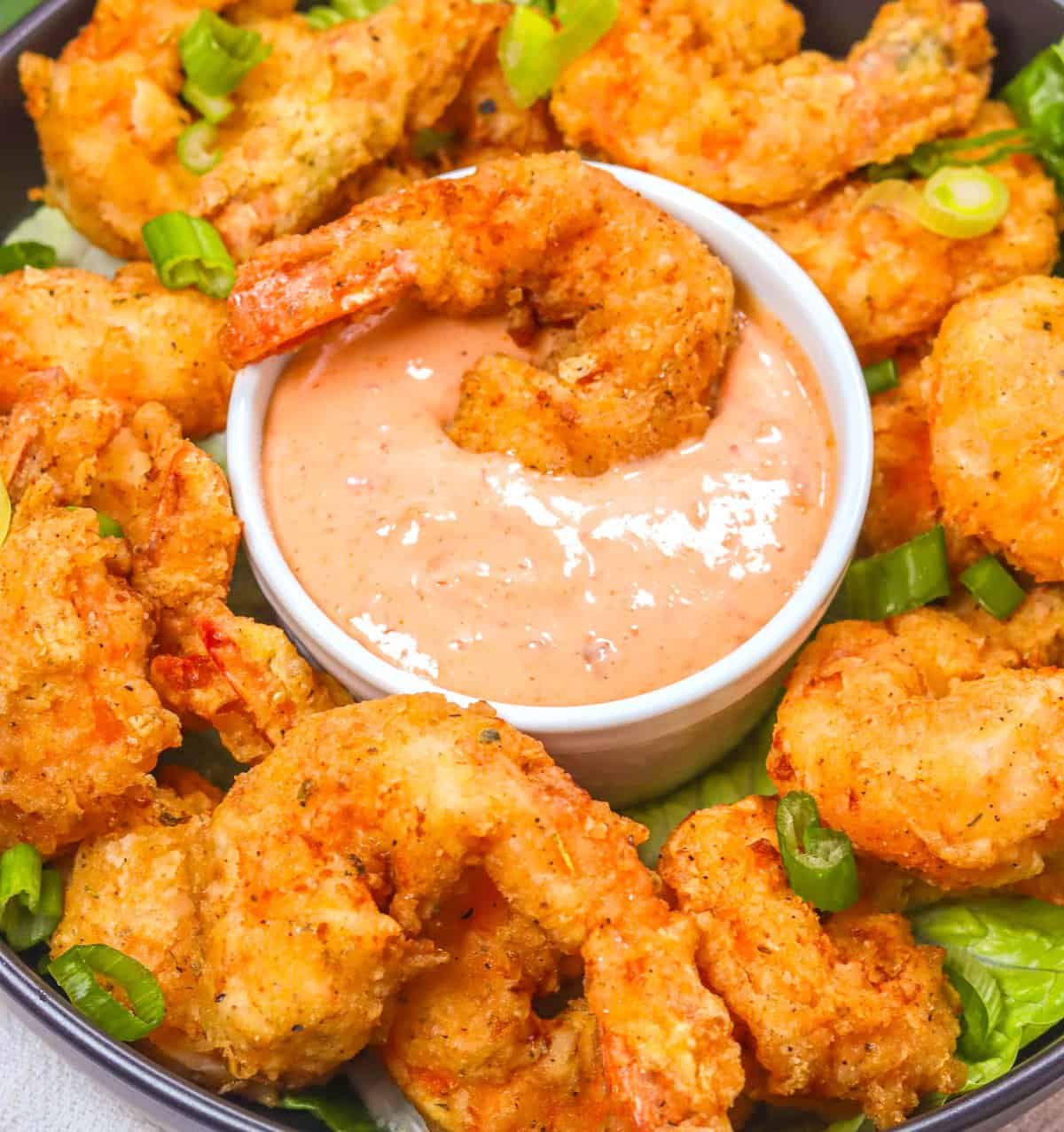 Dipping spicy fried shrimp in delicious Boom Boom sauce