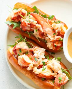 Two Connecticut Lobster Rolls and herbed butter for dipping for a delectable lunch