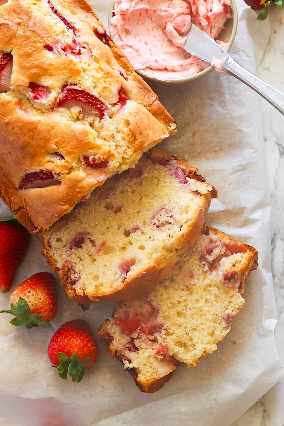 Sliced strawberry bread ready to be slathered with strawberry cream cheese