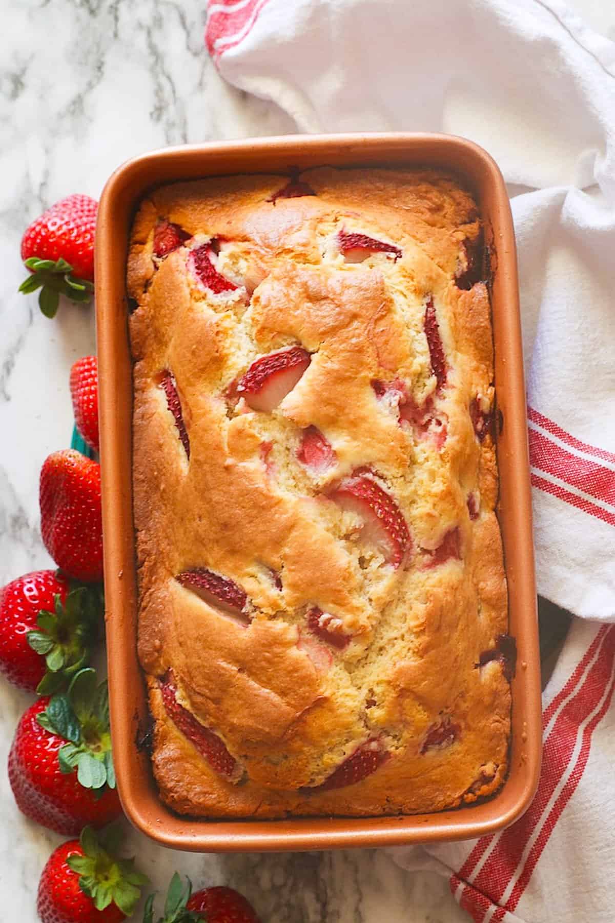 Decadent strawberry bread fresh from the oven waiting to cool and enjoy