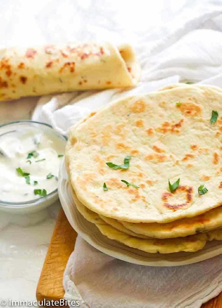 Insanely comforting flatbread ready to enjoy with a yogurt sauce