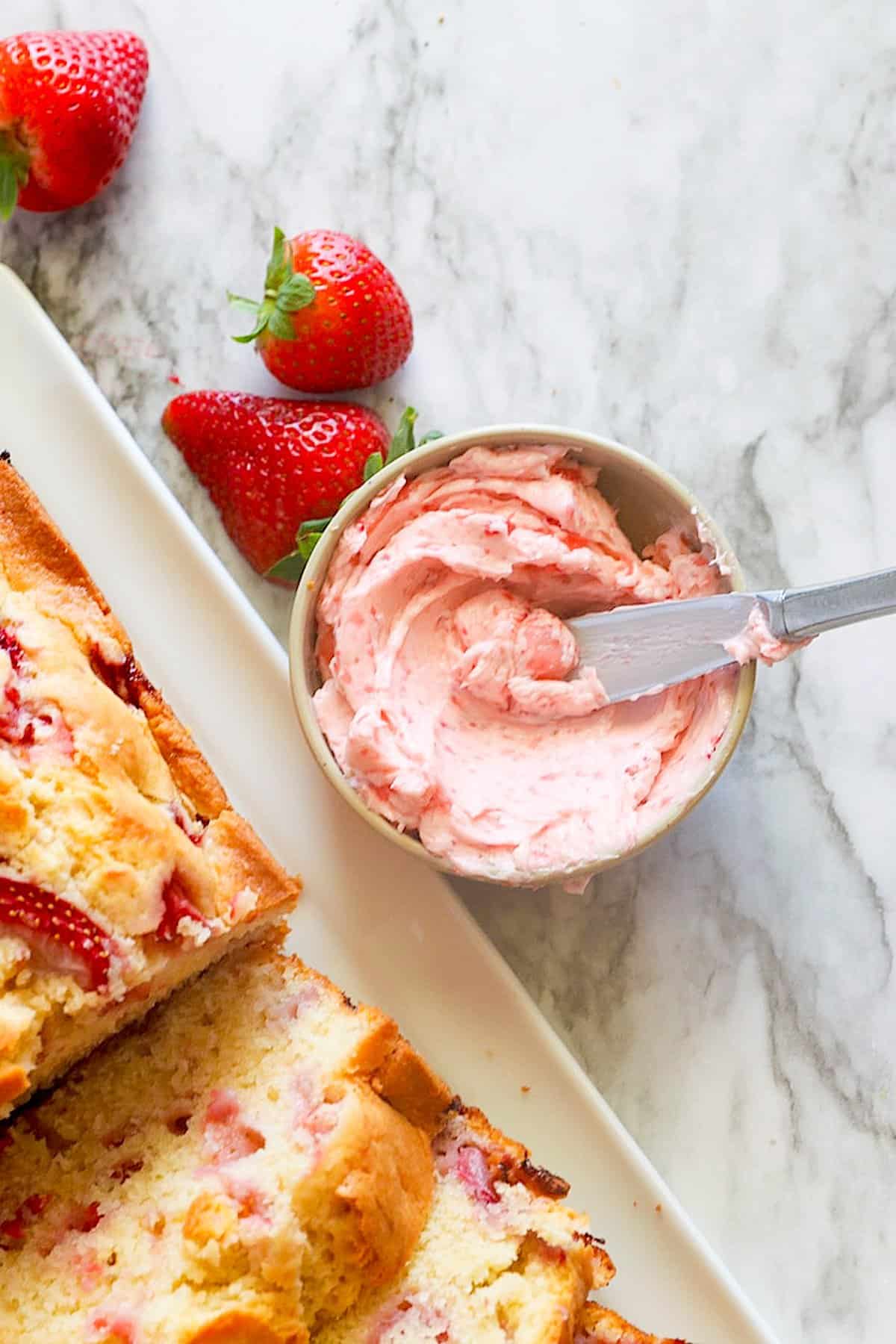 Spreading insanely good strawberry butter on freshly baked bread