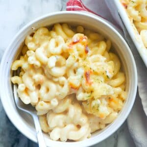 Enjoying a serving of smoked Gouda mac and cheese for pure comfort food