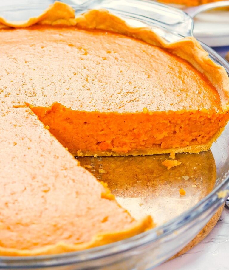 A freshly made Condensed Milk Sweet Potato Pie sliced and ready to serve