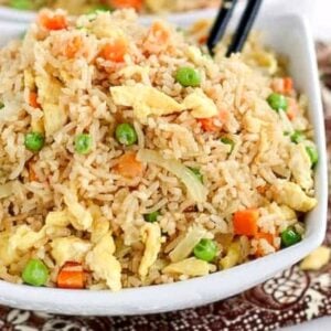 Enjoying delicious coconut fried rice with chopsticks