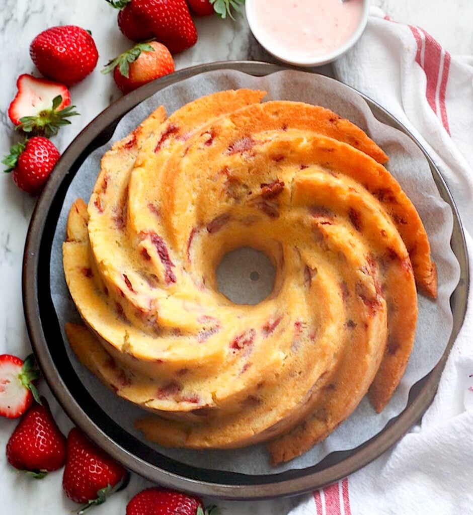 Glazing a gorgeous Strawberry Bundt Cake for pure comfort food