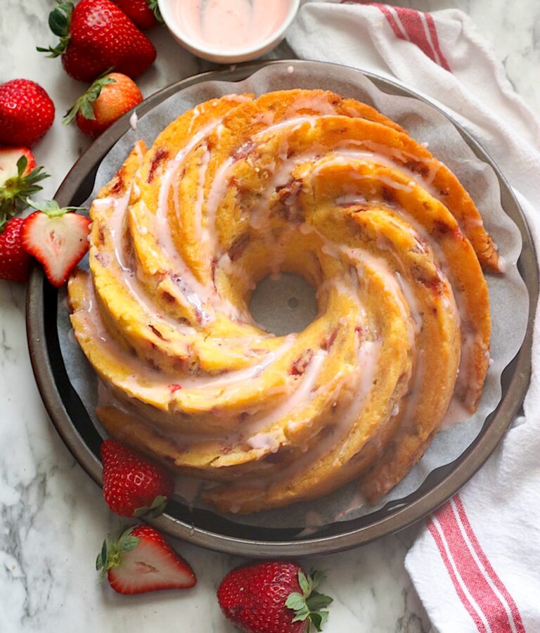 Glazing the finished strawberry bundt cake