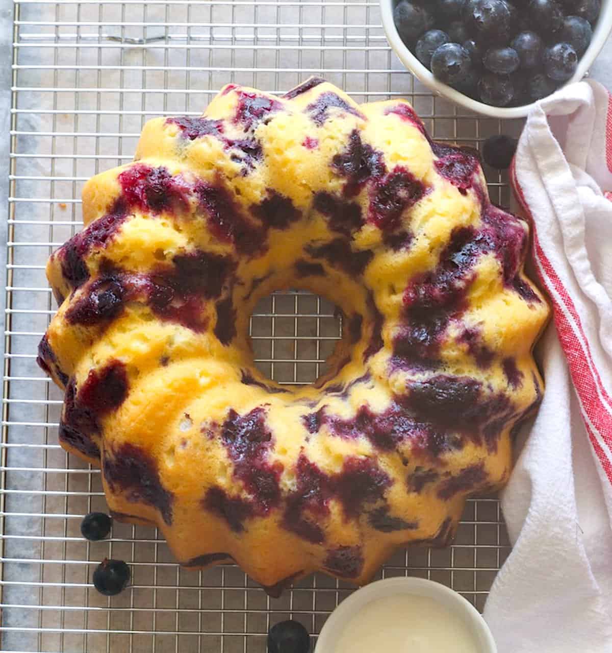 The finished blueberry bundt cake is ready to be glazed and enjoyed.