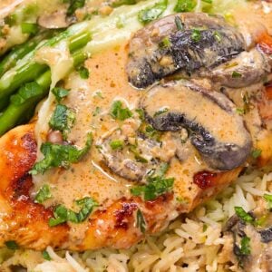 Serving chicken Maderia with seasoned rice and asparagus