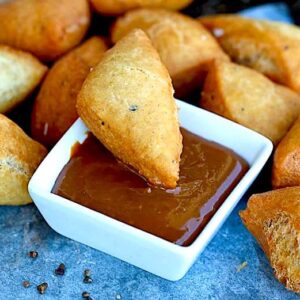 Dipping a soft and decadent mandazi in caramel sauce