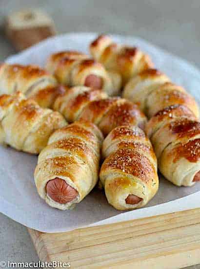 Loading up a plate with delicious hot dog pretzels