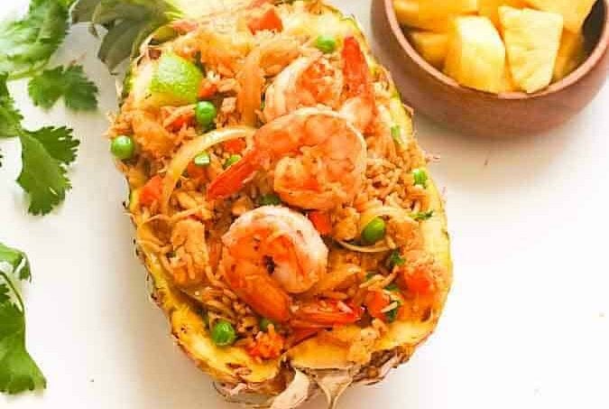 Delicious pineapple fried rice in a hollowed out pineapple